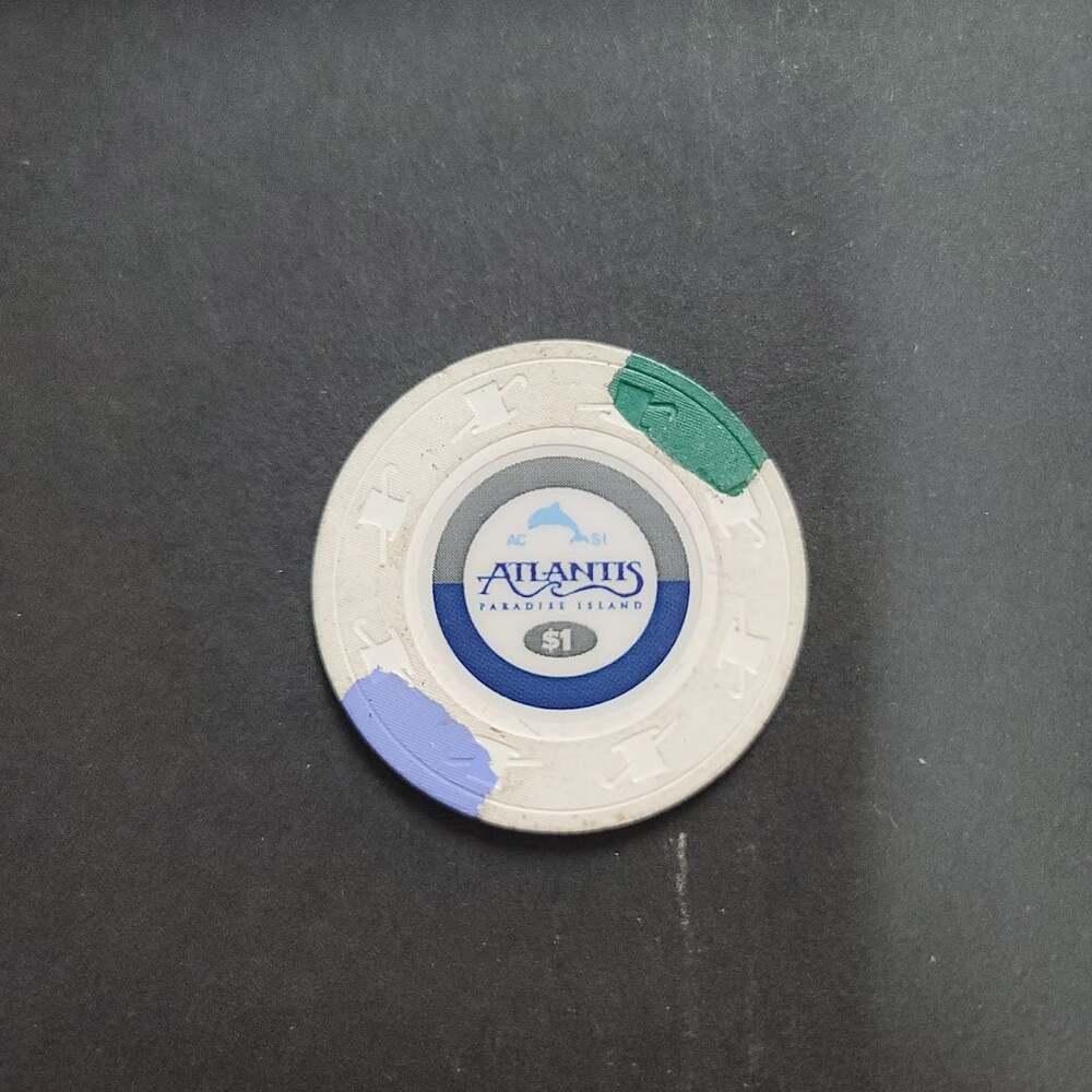 Casino Chip ATLANTIS PARADISE ISLAND $1 gaming white blue green dolphin